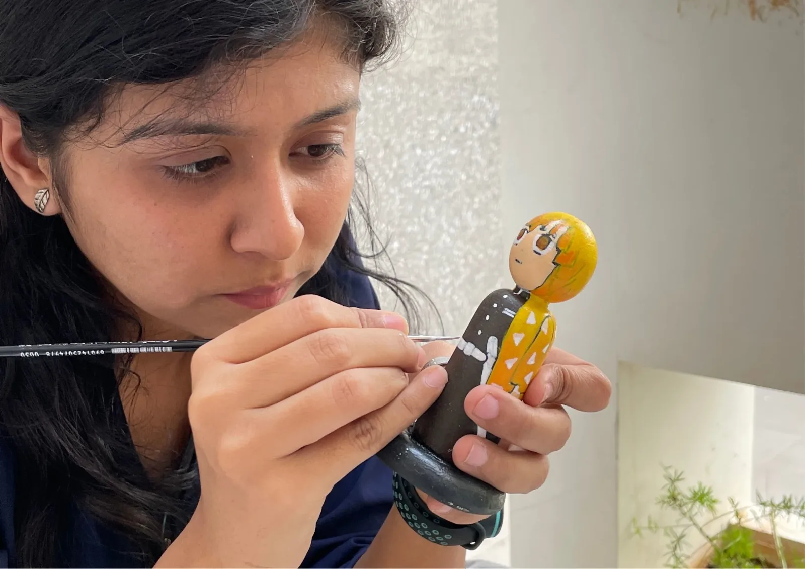 Every detail is hand-painted directly onto turned hardwood blanks using fine artist acrylics by Ashwini Abhang